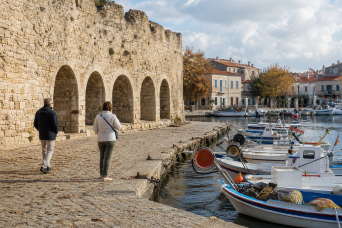 Editorial illustration of fishing boats in Eski Foça harbour, for an autumn walking day trip without a car